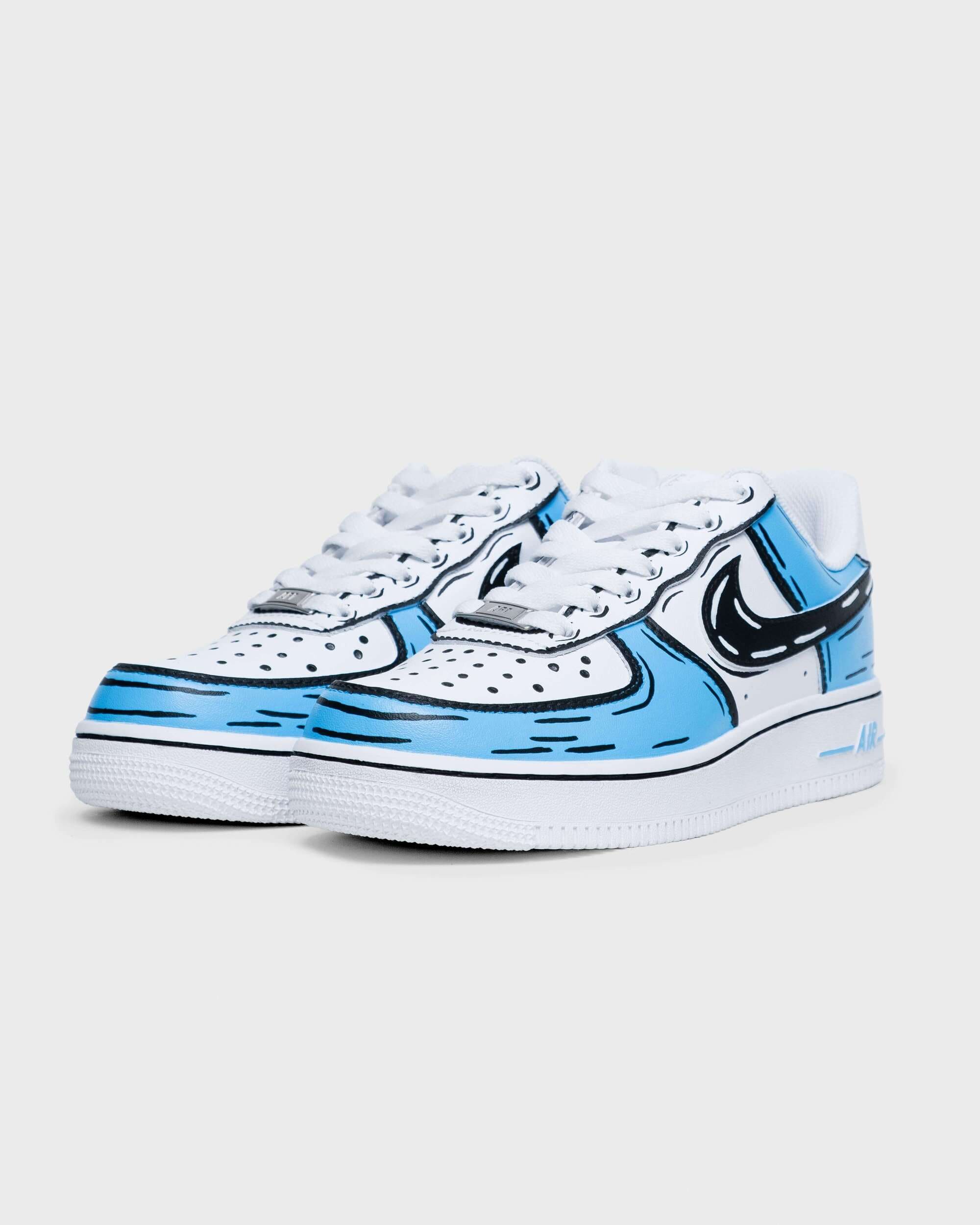 Angled view of hand-painted custom Air Force 1 sneakers featuring bold blue cartoon-style design elements.