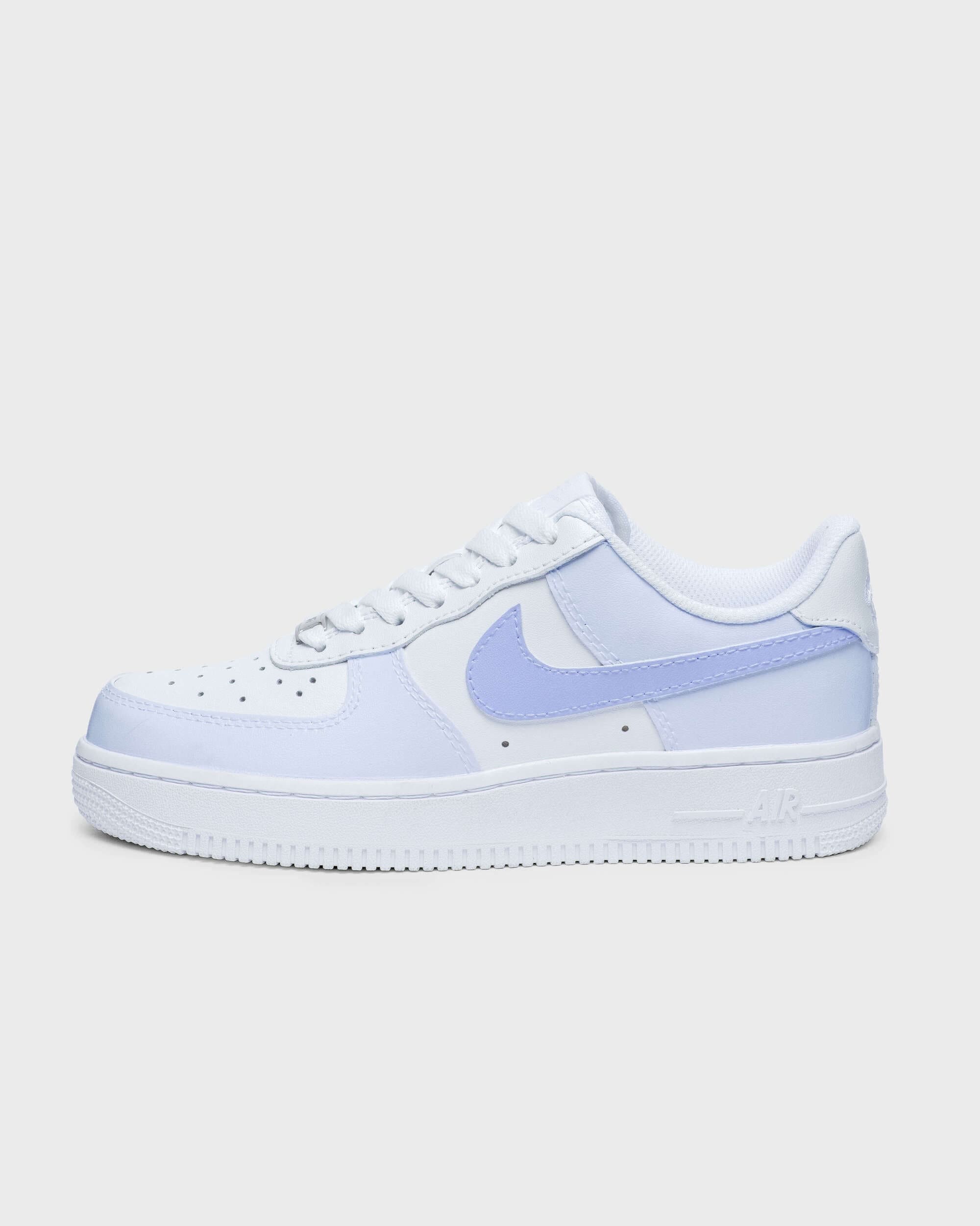 Close-up side view of Nike Air Force 1 with pink swoosh and detailing - Beautifully crafted personalized pink Air Force 1 sneakers, perfect for those who love pink.