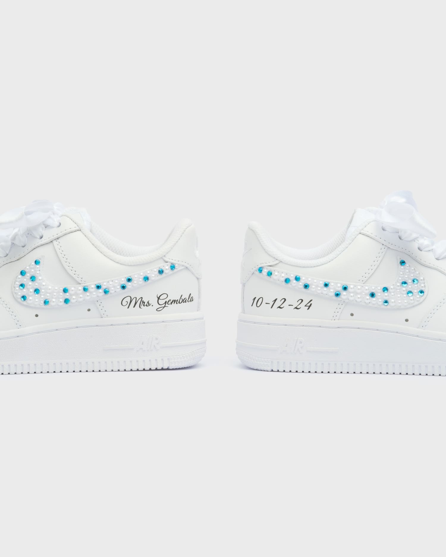 Personalized white Air Force 1 wedding sneakers with blue and white pearls. Custom bridal shoes featuring 'Mrs. Gembala' on one side and a wedding date on the other. Handcrafted and unique wedding footwear.