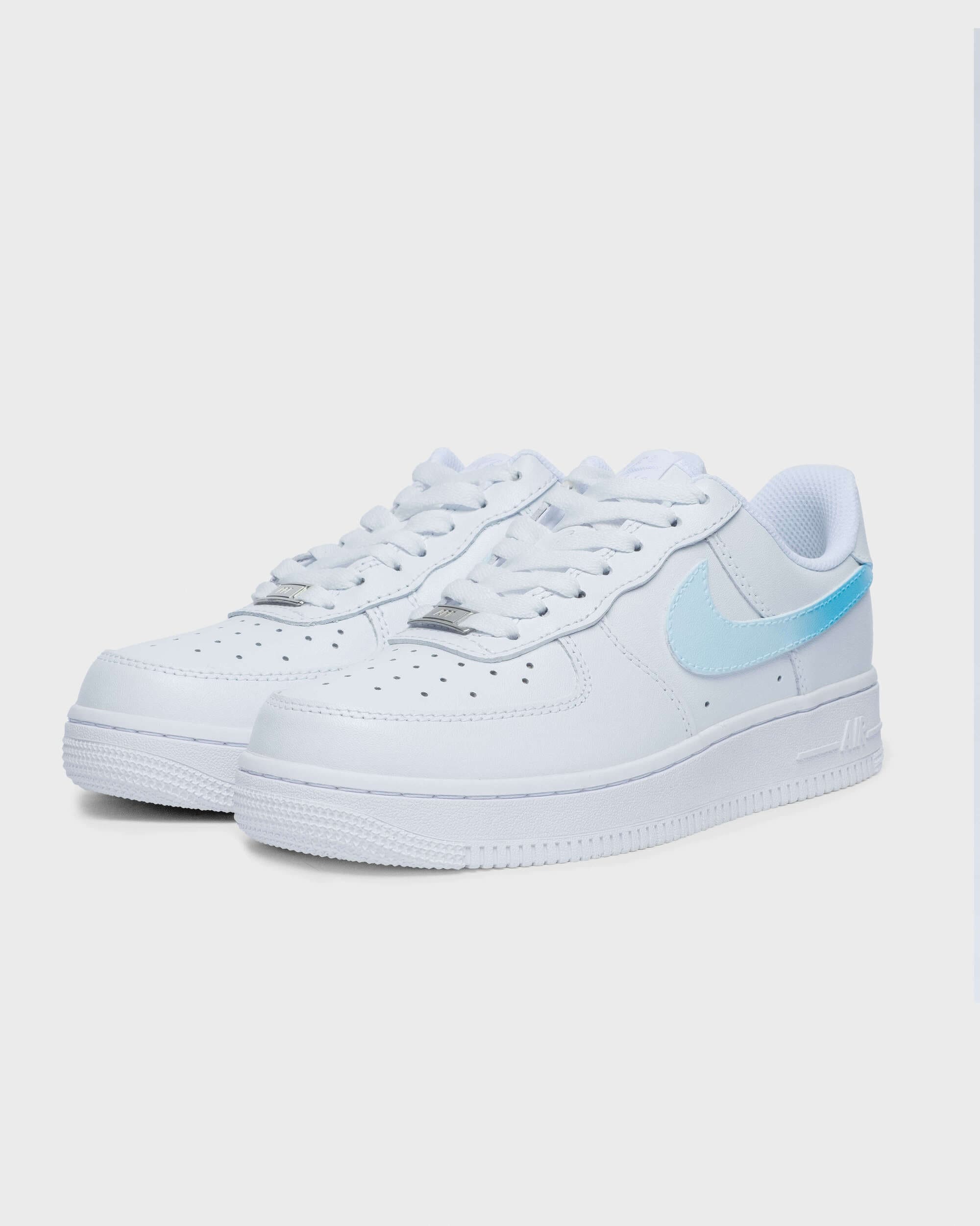 Side view of custom Air Force 1 sneaker with a light blue swoosh, featuring a simple yet stylish design on a white leather base, perfect for a unique and personalized style.