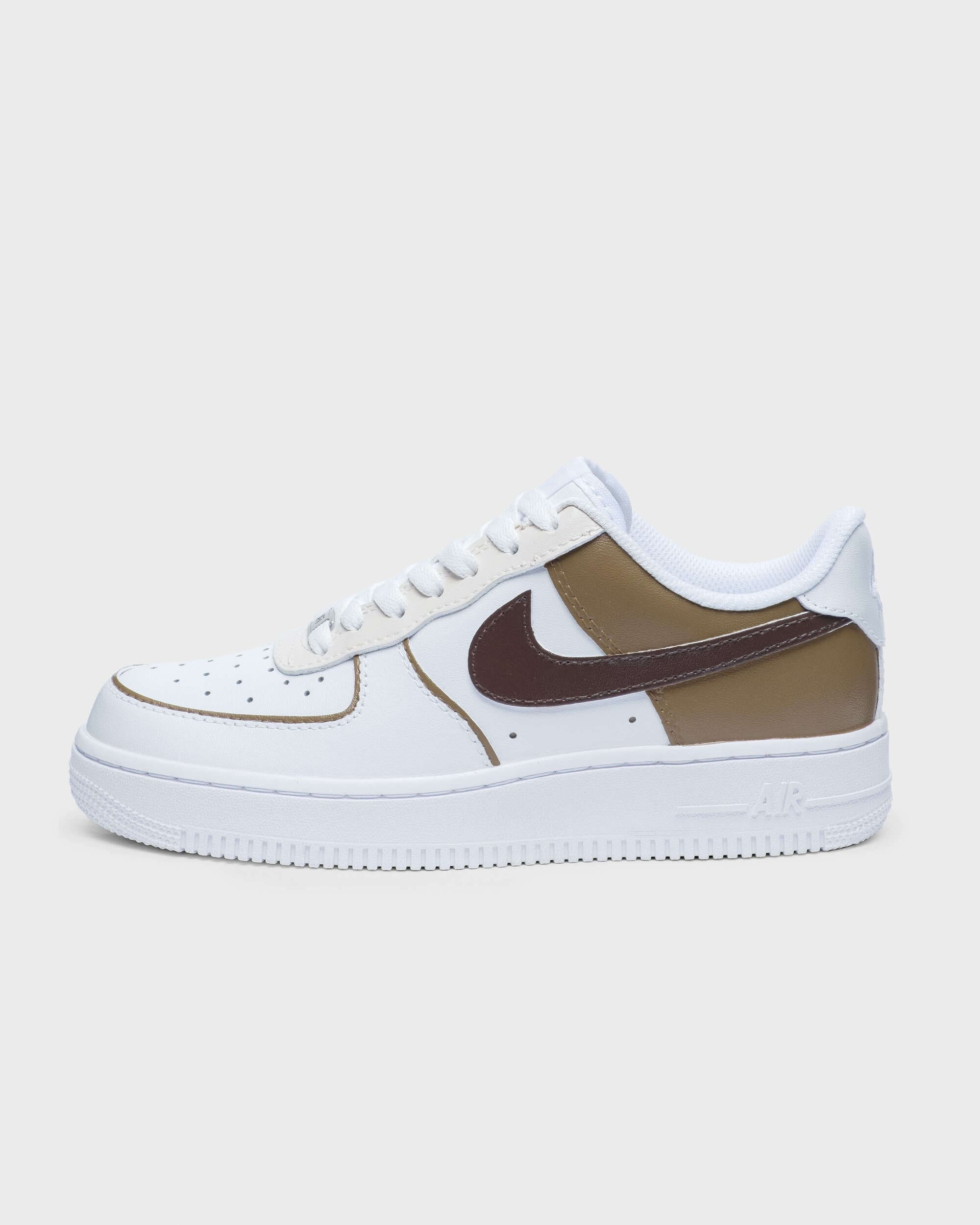 Single custom Air Force 1 sneaker with brown and tan accents, highlighting hand-painted personalization options for sneaker enthusiasts.