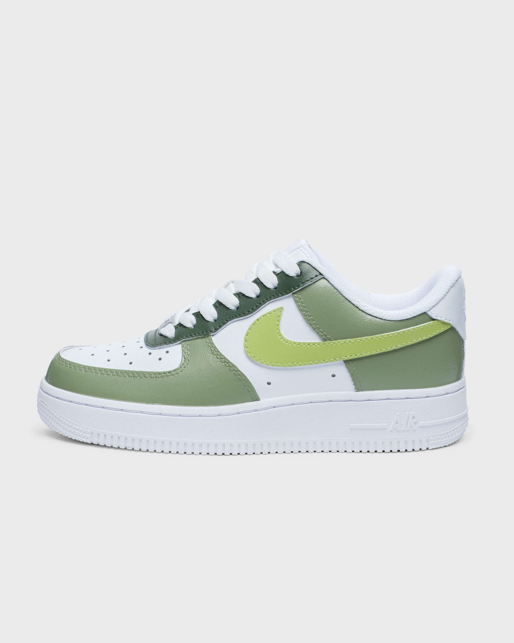 Side profile of Nike Air Force 1 sneaker in green with lime swoosh, displayed on a light background.