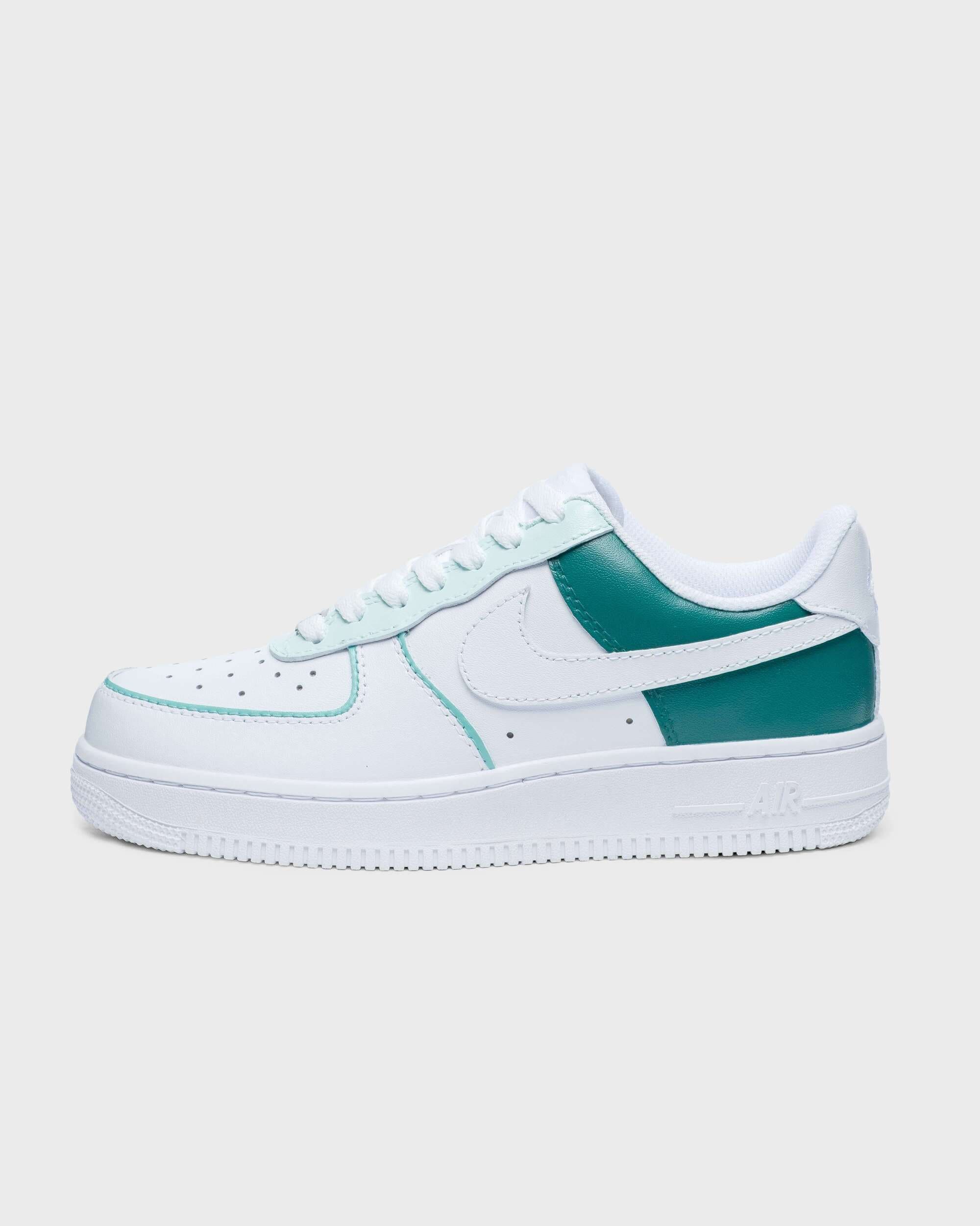 Side view of custom white and teal green Air Force 1 sneakers, ideal for personalized streetwear fashion.