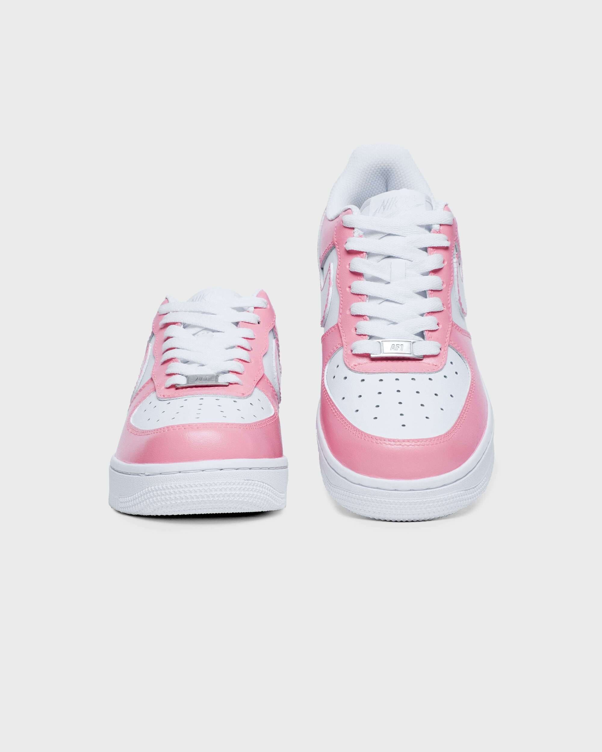 Front view of pink custom Air Force 1 sneakers with white laces – showcasing the unique pink and white design.