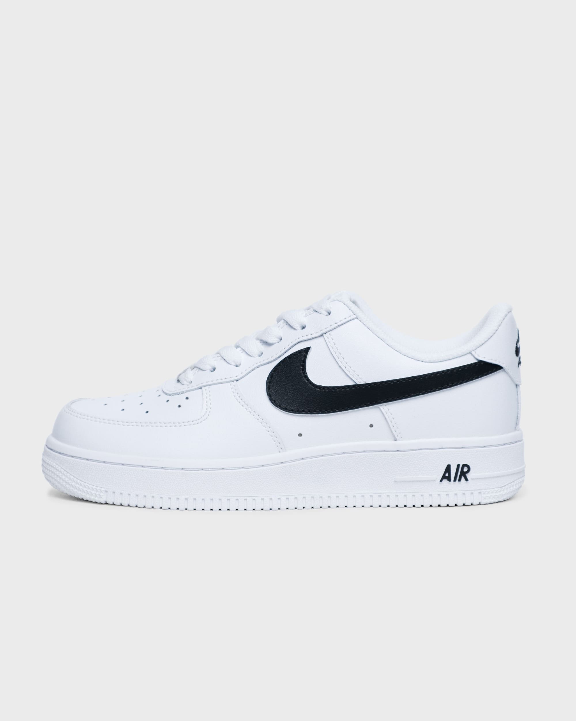 Classic Nike Air Force 1 sneakers customized with black swoosh, full side view showing timeless design and customization for modern style.