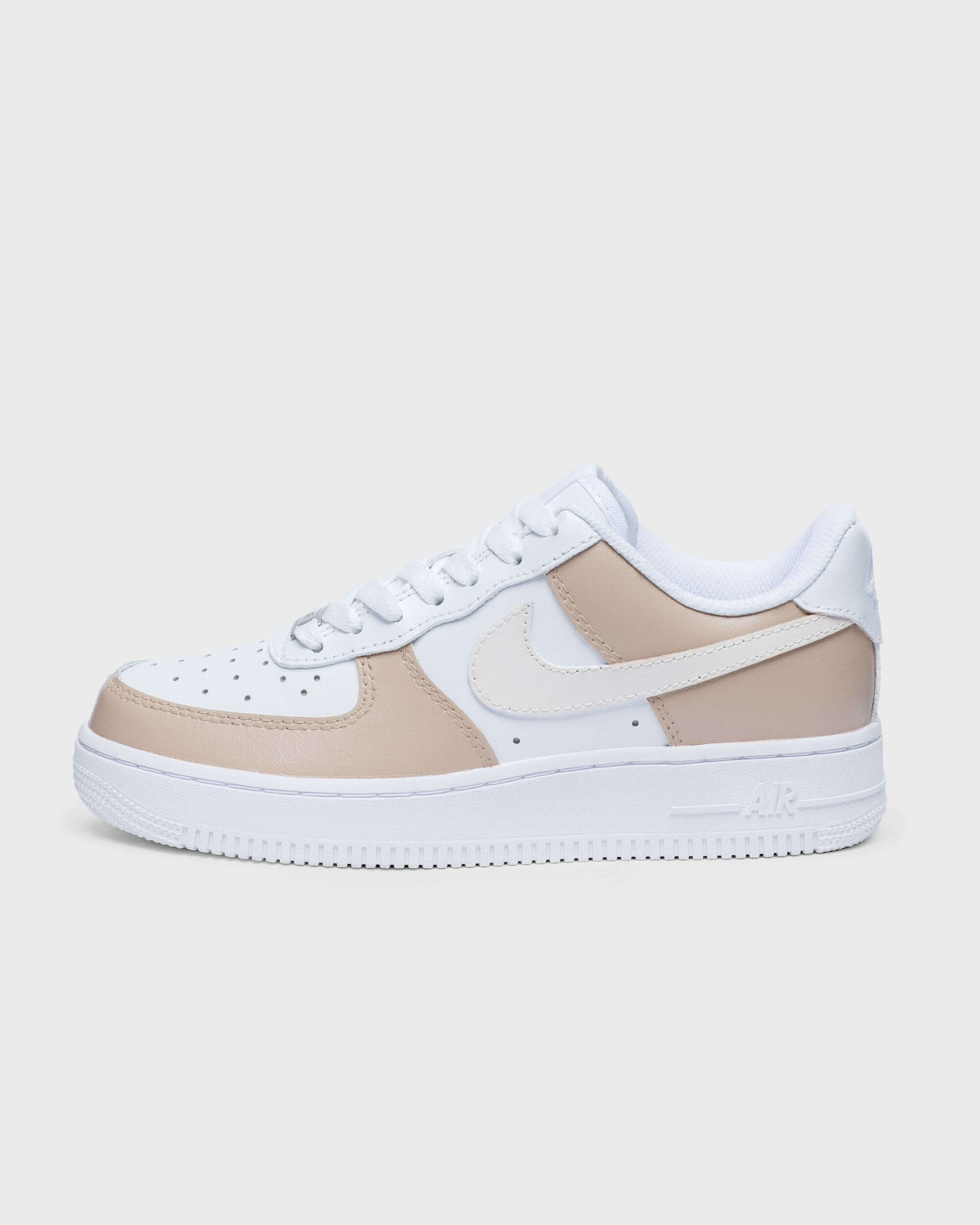 Custom cream-colored Air Force 1 sneakers with a minimalist design, featuring neutral tones for a stylish, modern look