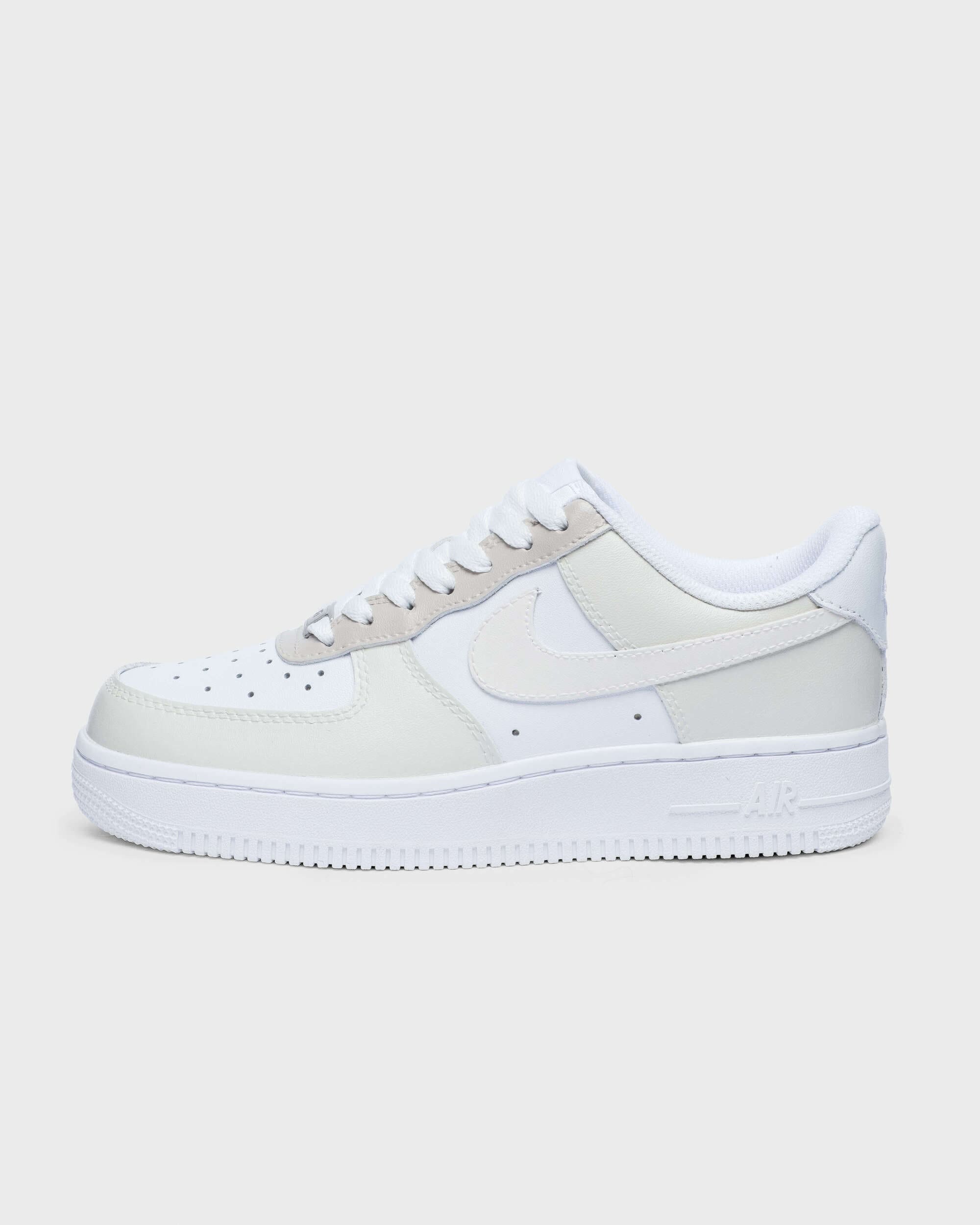 Custom beige and white Air Force 1 sneaker side profile with hand-painted detailing, perfect for a subtle personalized footwear option.