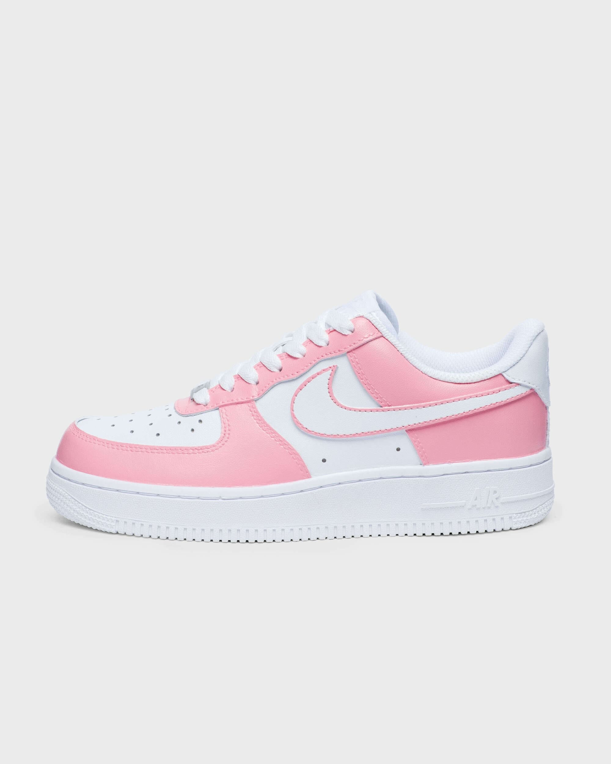 Full side profile of pink custom Air Force 1 sneakers – a detailed look at the custom pink Nike Air Force 1s.