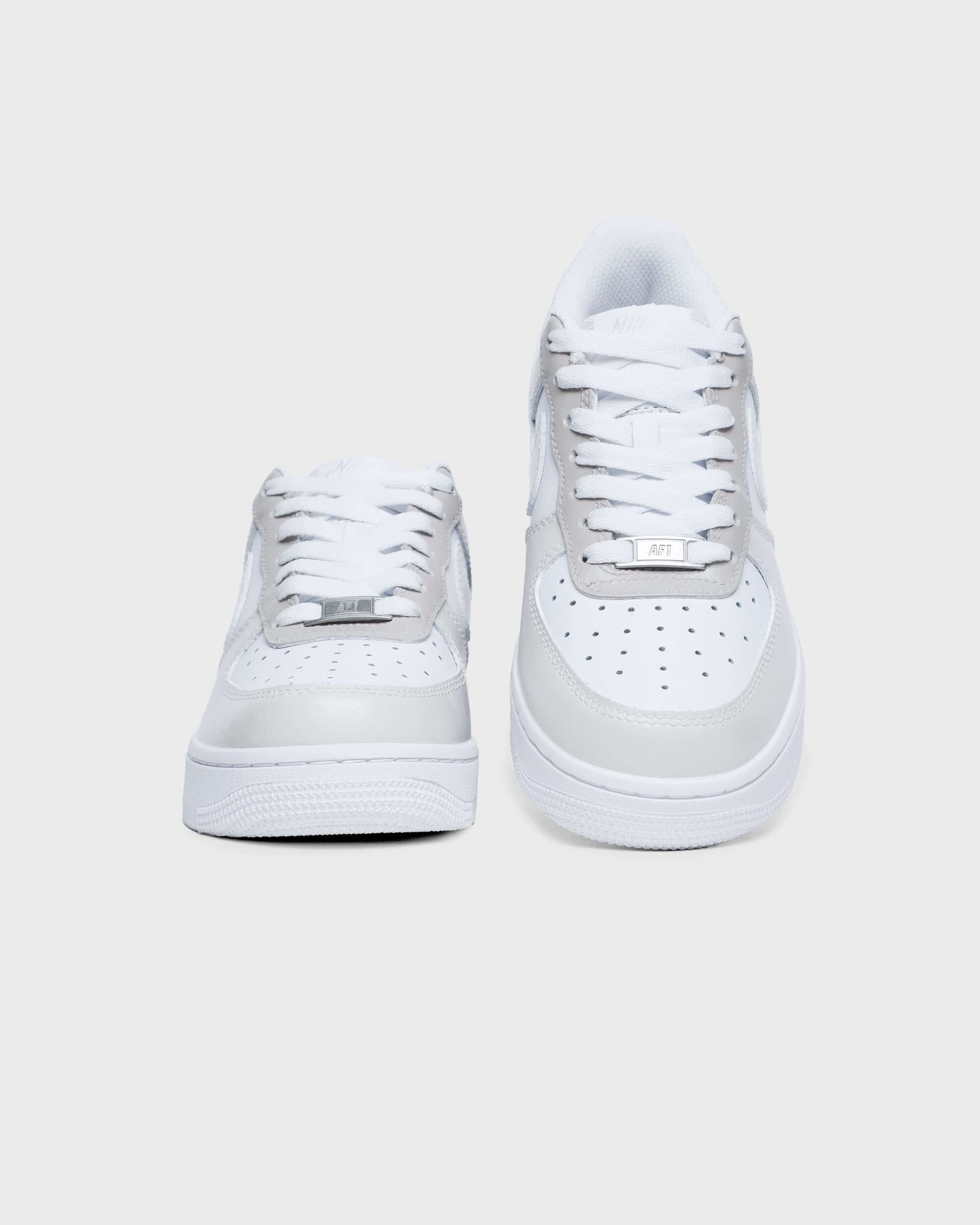 Front view of custom beige and white Air Force 1 sneakers with minimalist color detailing, hand-painted for a subtle yet stylish personalized look.