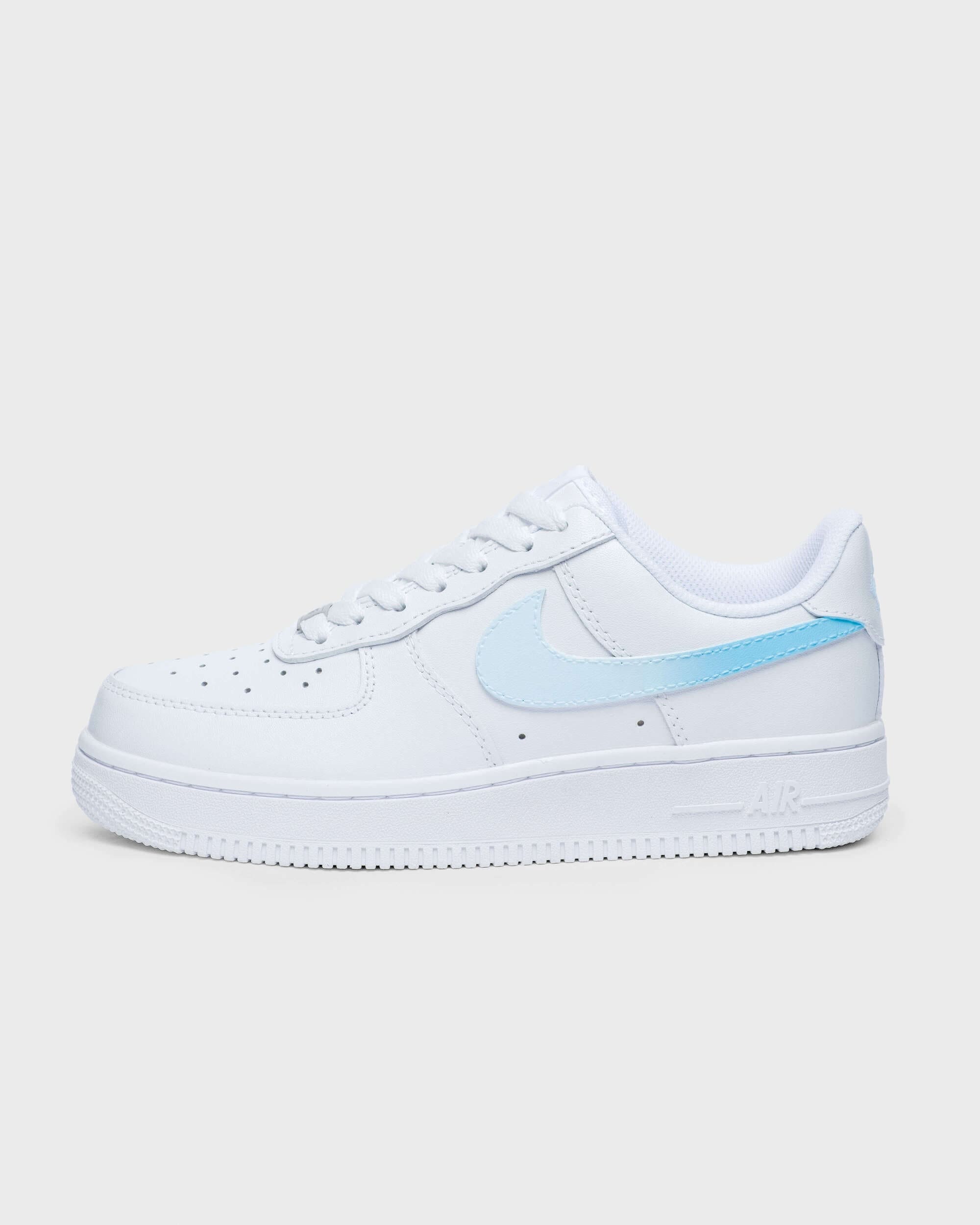 Side profile of custom Air Force 1 sneaker with a light blue swoosh, minimalist design on white leather, ideal for a fresh and personalized look.