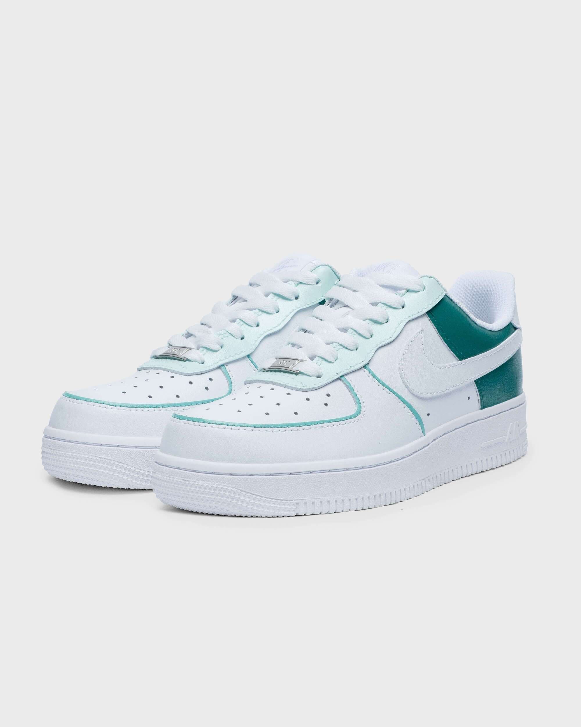 Angled side view of teal green and white custom Air Force 1 sneakers, perfect for personalized style.