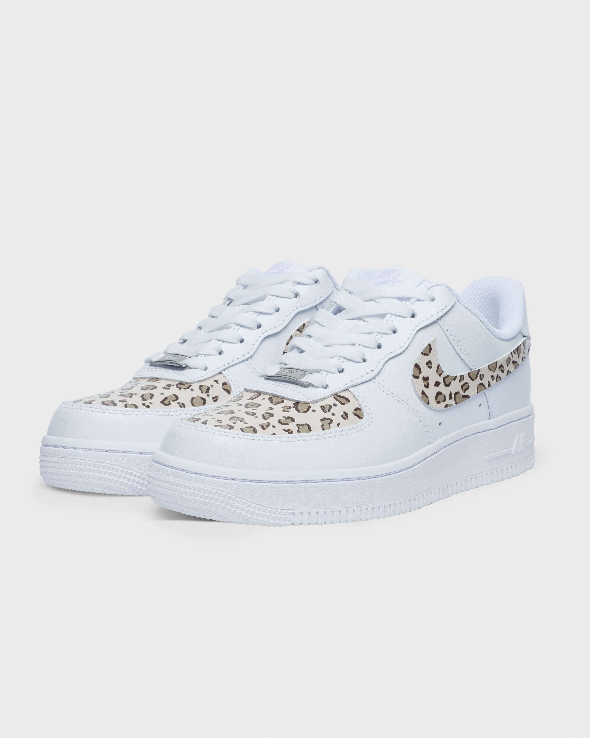 Side view of custom Air Force 1 sneaker with leopard print details on the swoosh and heel, creating a wild and unique personalized style